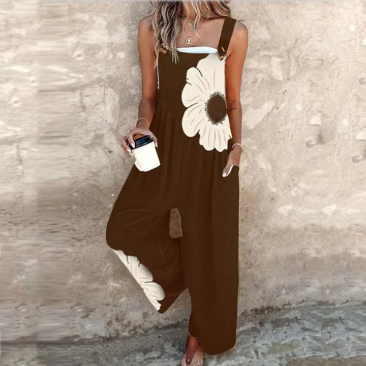 Schwarze Latzhose mit Blütenmotiv